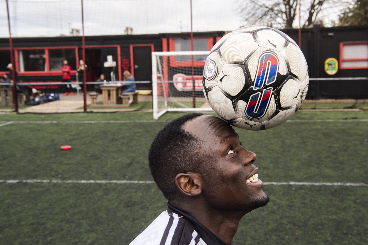 Abdulsalam, a Fair Shot FC player, balances a football on his head