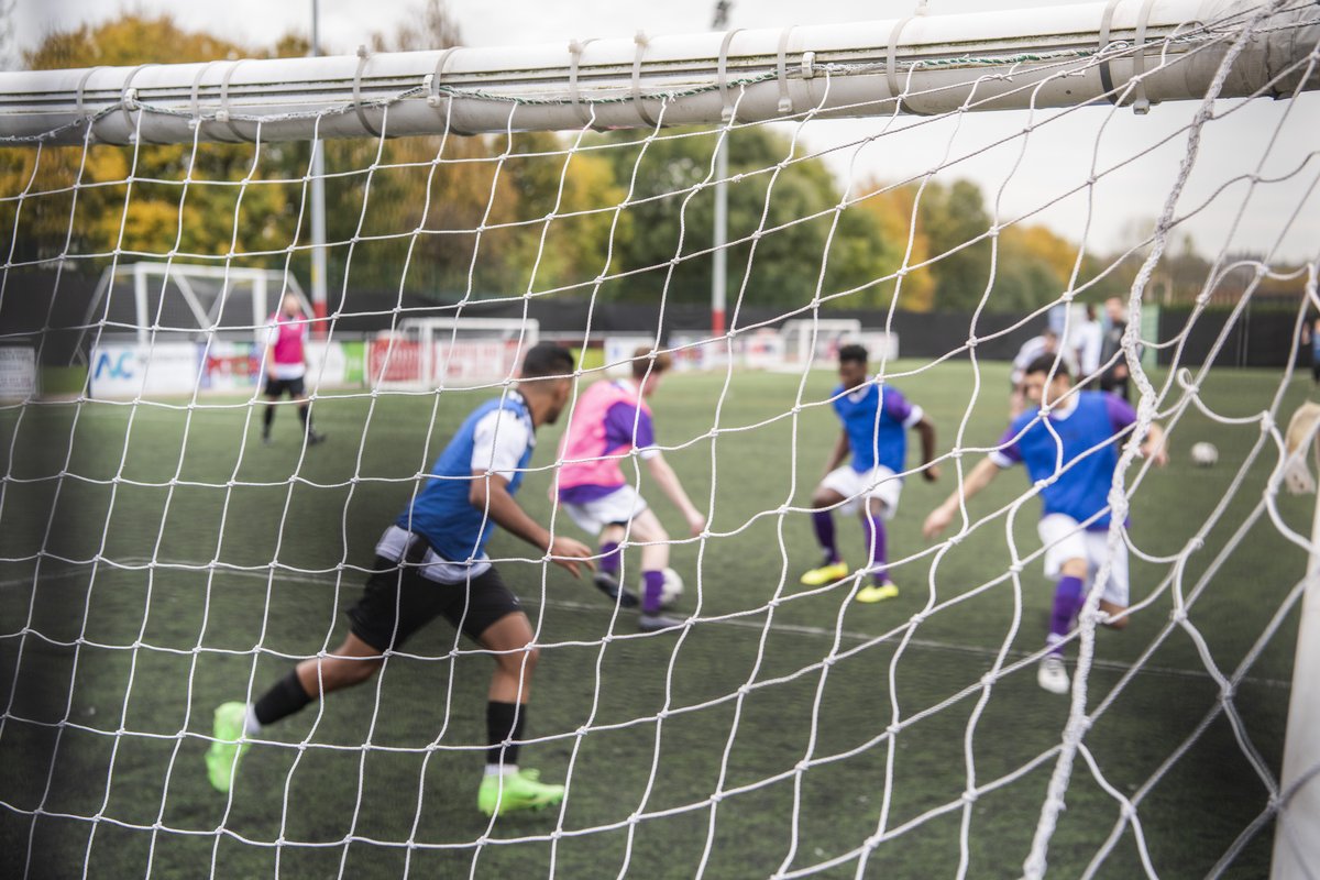 Fair Shot FC playing football in front of a goal net